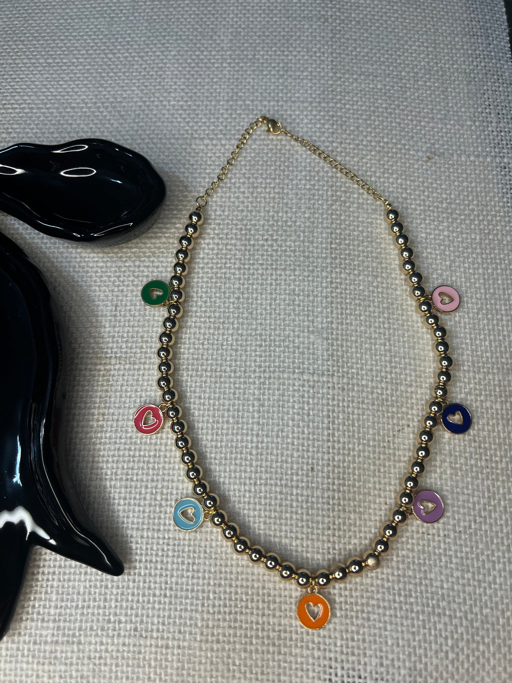 Beaded necklace with circular heart