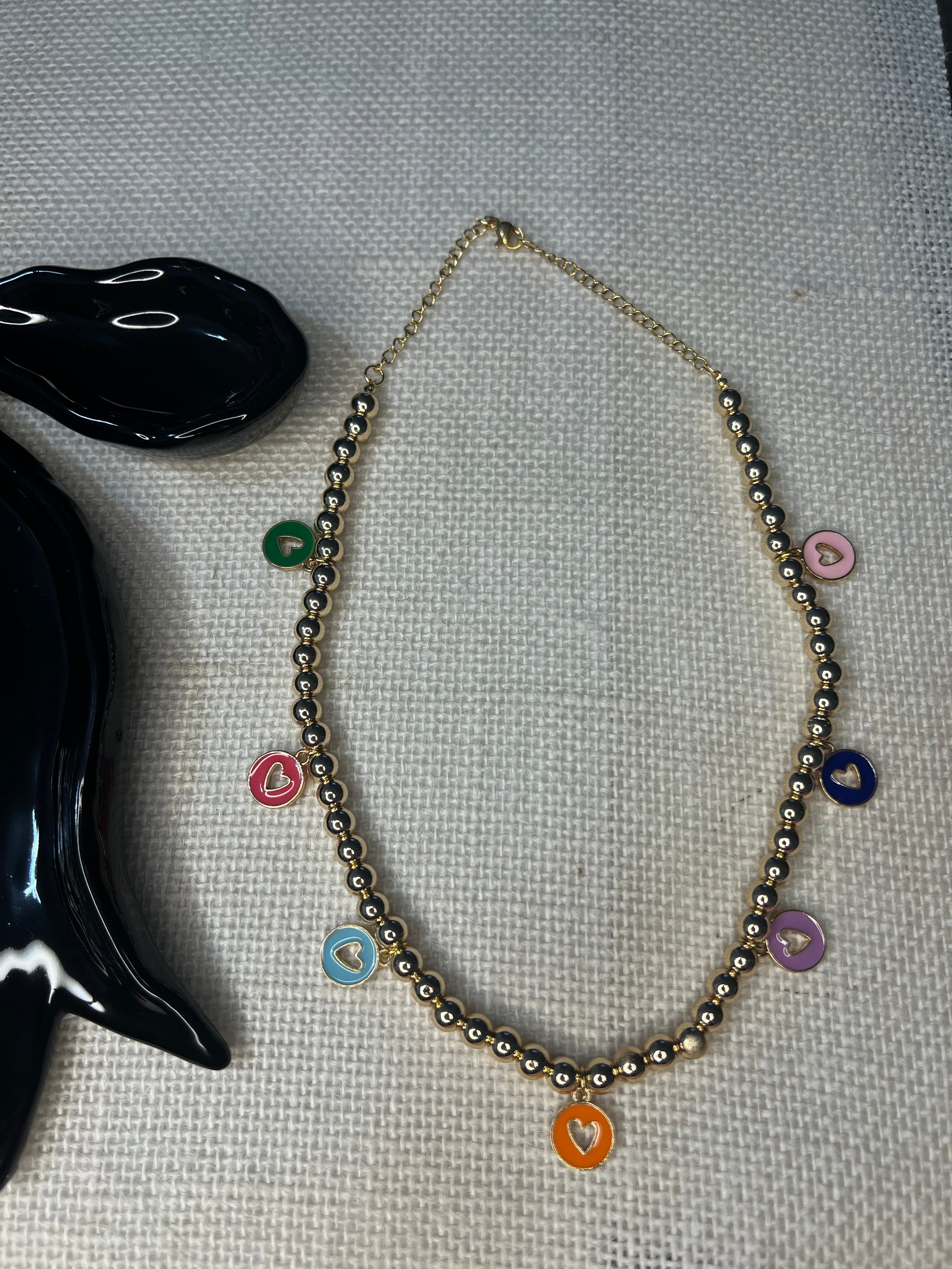 Beaded necklace with circular heart